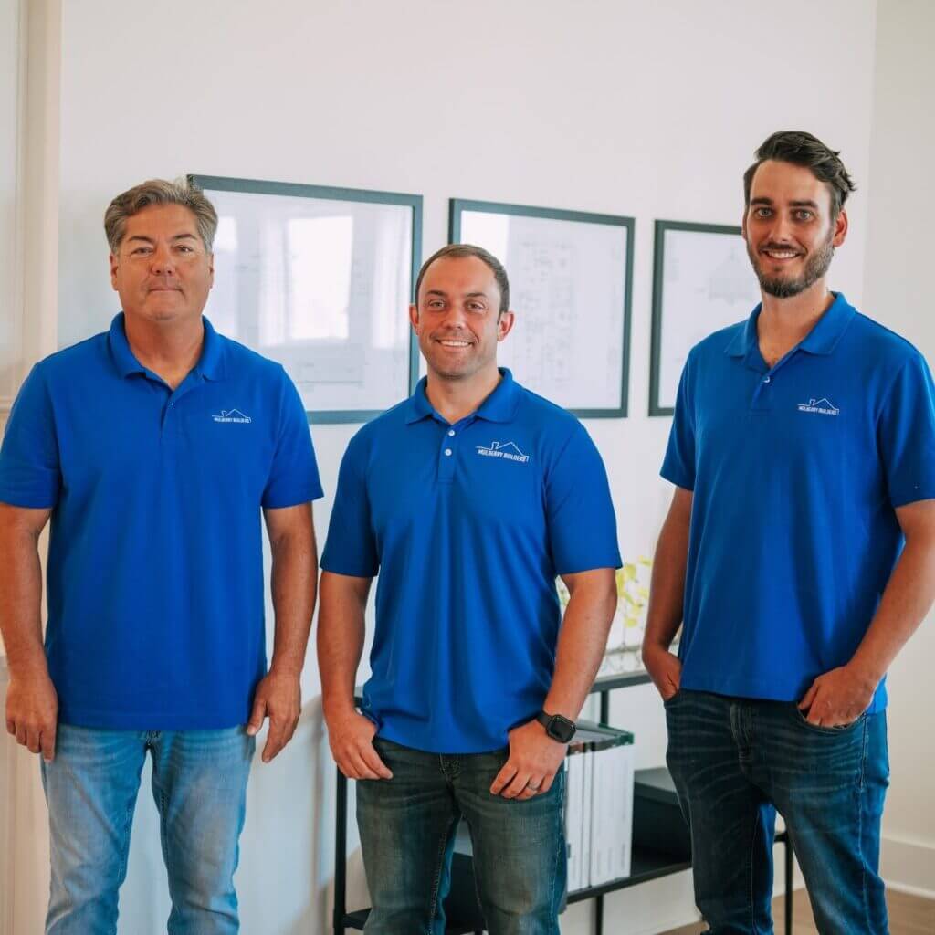 Mulberry Roofing team members in branded polo shirts