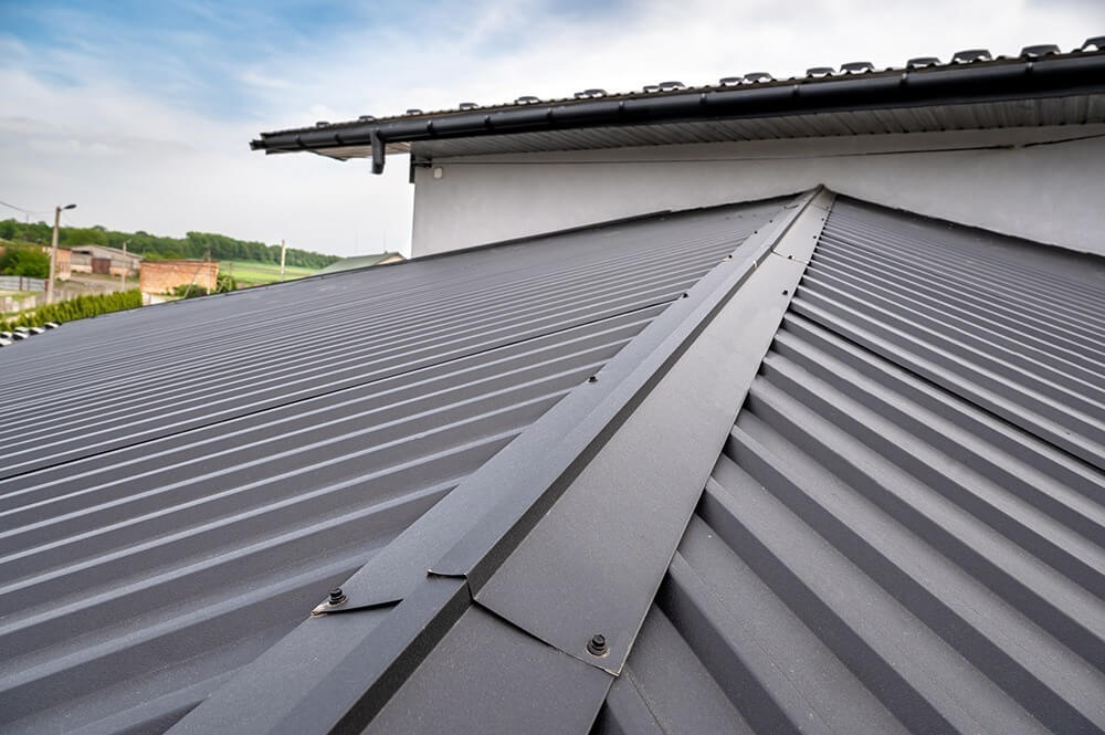 Close-up of a dark gray standing seam metal roof